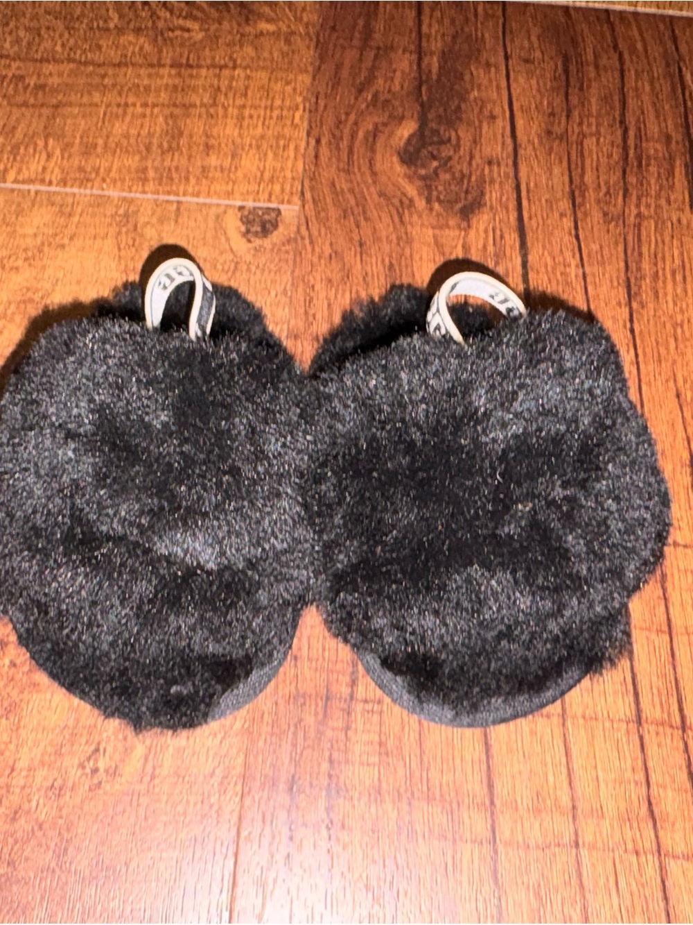 UGG Baby Walker Sheepskin Pom Pom Slippers in Black